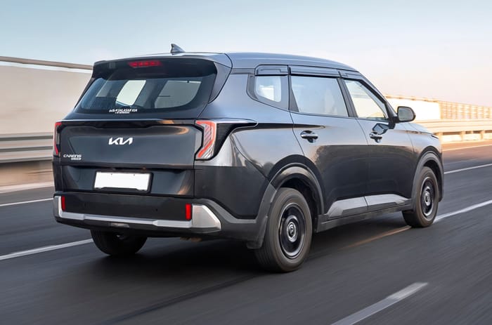 Kia Carens Clavis petrol rear right side on road