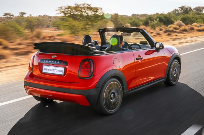Mini Convertible rear right side on road driving