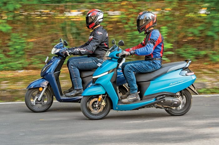 Honda Activa and TVS Jupiter left side profile riding shot on road